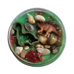 sensoryfun-dinosaurus-speelklei-hetspeellab Pot sensorydough dino's van bovenaf met beeld op speelfiguren